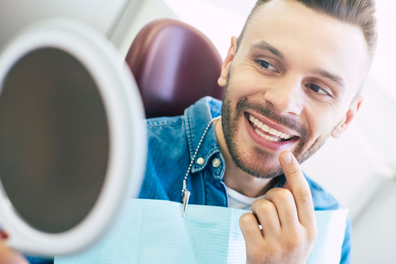 Dental Patient Smiling After Tooth Whitening Procedure