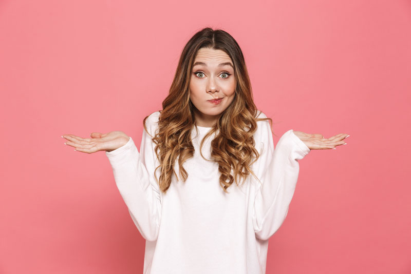 Questioning Dental Patient Before Her Dental Implant Procedure