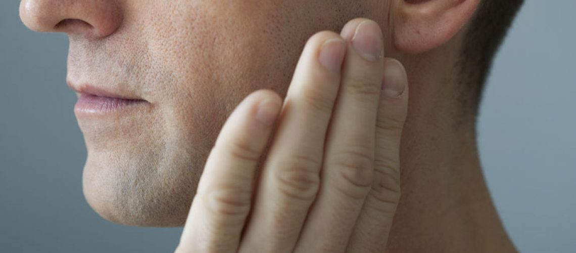 Dental Patient Suffering From The Affects Of TMJ Joint Disorder