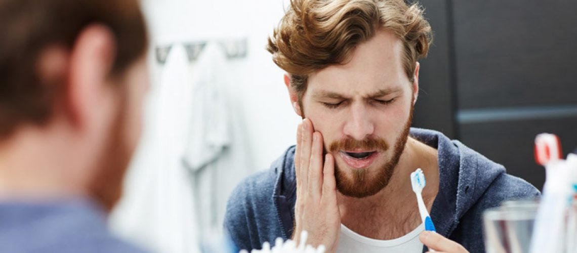 Dental Patient Suffering From Mouth Pain Due To Gum Disease