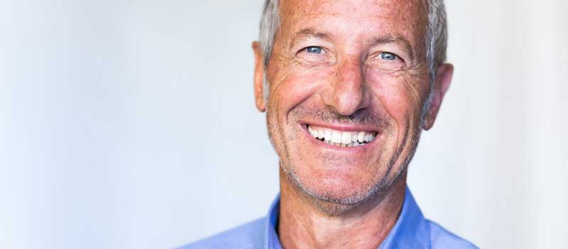 a patient smiling after his dental implant procedure